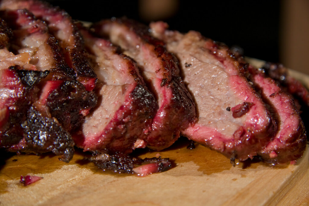 Brisket Chopped on a Wooden Cutting Board